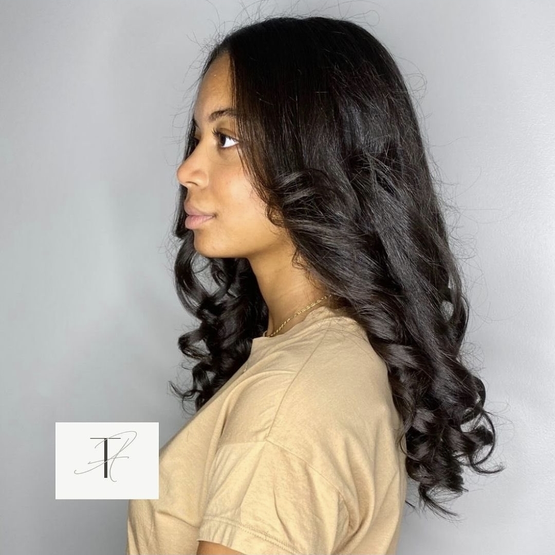 Long silk-pressed hair with soft bouncy curls